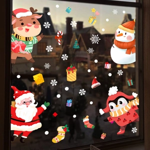 Christmas window decals featuring Santa, reindeer, and snowflakes on a glass surface
