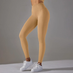 Detail of high-waisted ginger yoga pants with honeycomb texture for tummy control