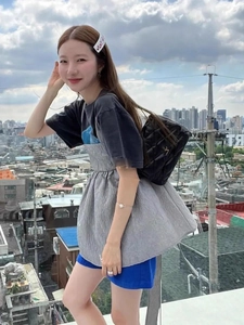 Outdoor street style look with grey textured bubble puff top and blue shorts