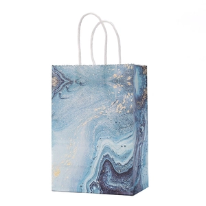 Blue marble texture gift paper bag with gold glitter accents and white rope handles