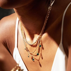 Three-layer gold stainless steel necklace featuring rope chain and green gemstone charms