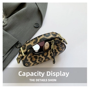 Leopard print hobo bag capacity display with interior items and golden zipper detail