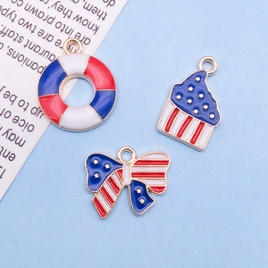 Detailed view of patriotic US flag charms in lifebuoy cupcake and bow tie shapes