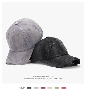 Close-up of distressed baseball caps with frayed brims and vintage washed texture details