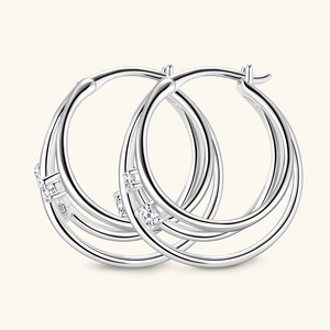 Elegant silver triple-layered hoop earrings with sparkling moissanite stones