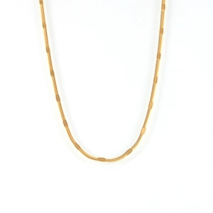 Flat textured snake chain necklace in 18k gold plated stainless steel on white background