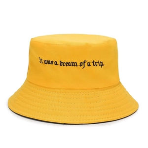 Yellow cotton bucket hat with black gothic text embroidery for casual sun protection