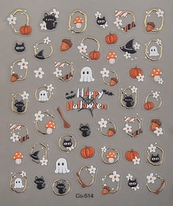 Detail of Halloween nail stickers featuring pumpkins, black cats, ghosts, and gold trim