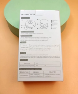 Instruction manual for electric nail trimmer showing parts list and battery setup