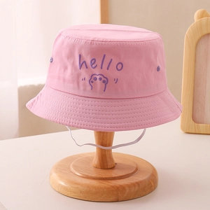Close-up of pink cotton kids bucket hat with purple hello embroidery and chin strap