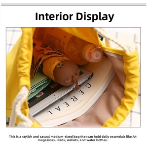 Spacious interior of yellow canvas drawstring bag holding A4 books and a tablet