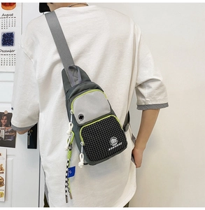 Detailed back view of water-resistant gray chest bag with multiple pockets and adjust strap