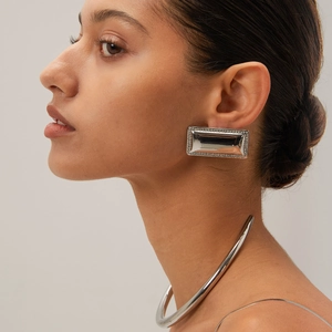 Elegant silver stainless steel choker and rhinestone rectangular earrings on a model