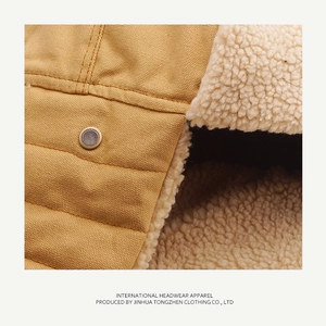 Detail of ginger canvas fabric with white fleece lining and metal air vent on the hat