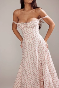 Detail of pink floral dress featuring pleated bust tie and delicate rose print texture