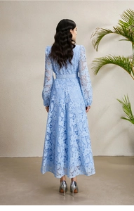 Detail of the blue lace maxi dress back with puff sleeves and cinched waist belt