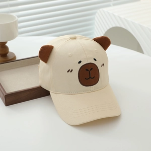 Detailed close-up of beige cotton baseball cap with cute 3D bear ears and embroidery