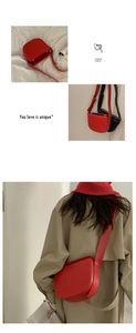 Detail view of red PU leather saddle bag showing adjustable strap and gold metal buckle