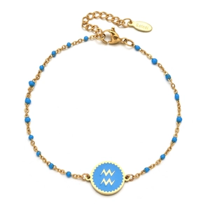 Detail of gold stainless steel bracelet with blue beads and Aquarius zodiac pendant