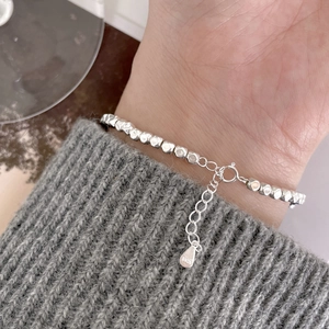 Minimalist S925 sterling silver beaded bracelet with square stone charm worn on wrist