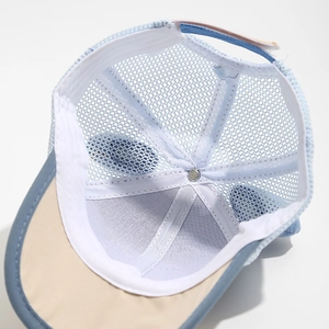 Close-up of baby mesh baseball cap interior showing white cotton sweatband and breathable mesh