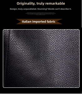 Detail of high-quality black pebbled leather texture on a large capacity tote bag