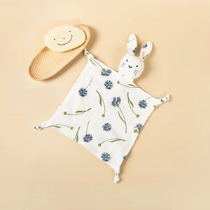 Detail of baby organic cotton security blanket with bunny head and blue floral print