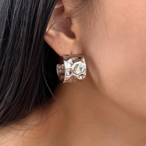 Minimalist silver lava textured wide hoop earrings with metallic molten wrinkle design