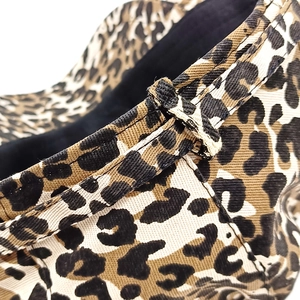 Close-up of leopard print canvas fabric with reinforced stitching on the vintage hat