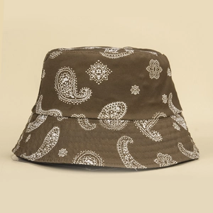 Brown paisley reversible bucket hat made of canvas with classic white paisley pattern