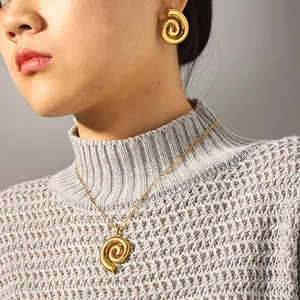 18k gold plated stainless steel spiral jewelry set with hoop earrings and necklace on model