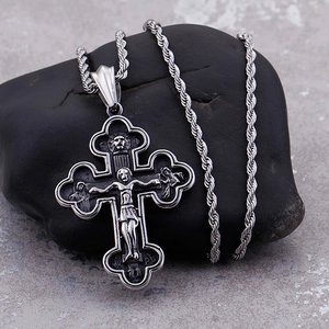 Vintage silver crucifix pendant necklace with jesus figure on textured black stone