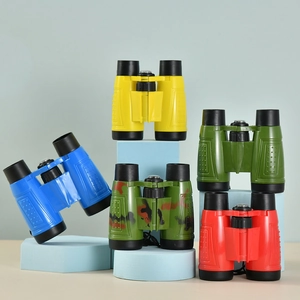 Colorful 6x30 children's toy binoculars in yellow, blue, green, and red on display
