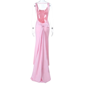 Detailed back view of pink backless gown with large silk bow and long flowing train
