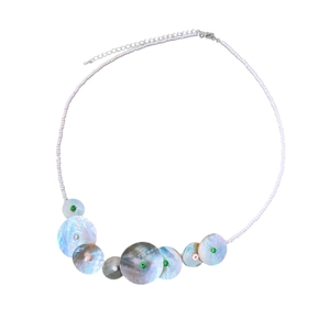 Elegant white seed bead necklace featuring iridescent shell discs and green accent beads