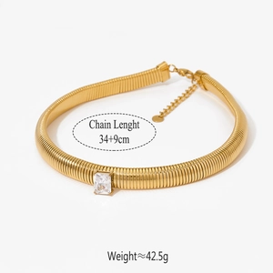 Macro shot of gold snake chain with zircon stone including weight and length data