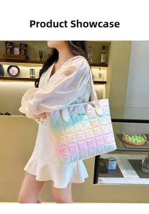 Detail shot of quilted tote bag with pastel gradient pattern and golden logo