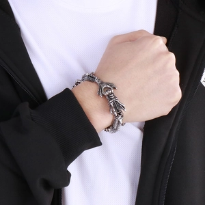 Close-up of vintage punk dragon head bracelet in stainless steel with detailed scales