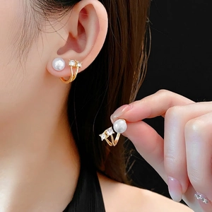 Elegant gold pearl and diamond earrings in a unique double-arc design for women