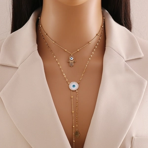 Double-layer gold stainless steel necklace with Hamsa hand and blue Evil Eye pendants