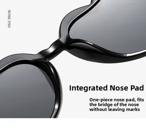 Detail view of the black heart sunglasses showing the comfortable integrated nose pad
