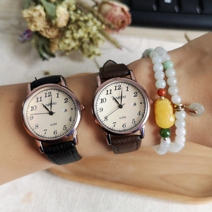 Quartz watch with large dial calendar and leather strap in black and brown finishes