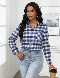 Detail of blue and white plaid flannel shirt with textured fabric and classic button-up collar