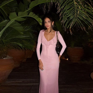 Slim fit pink long sleeve ruffle dress with deep V-neck and drawstring detail