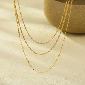 Three-layer gold stainless steel necklace with twisted rope and shimmering sequin chains