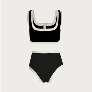 Detail of black and white two-piece bikini featuring square neckline and ribbed texture