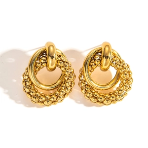 Detail showing vintage gold titanium steel earrings with beaded and smooth double rings