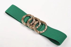 Detail of green elastic waist belt with textured gold interlaced triple ring buckle closure