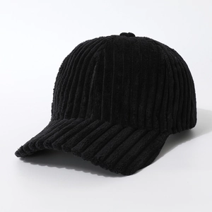 Close-up of the black corduroy fabric texture and vertical stripes on the baseball cap