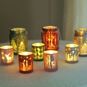 Christmas glass candle holders with elk and forest patterns in assorted festive colors